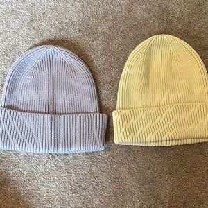 Two hats from GAP. Purple one still has tags. Cream one worn once.